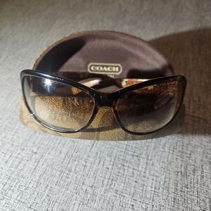 Coach Women's Tortoise Brown Sunglasses with Floral Interior and amber lenses.